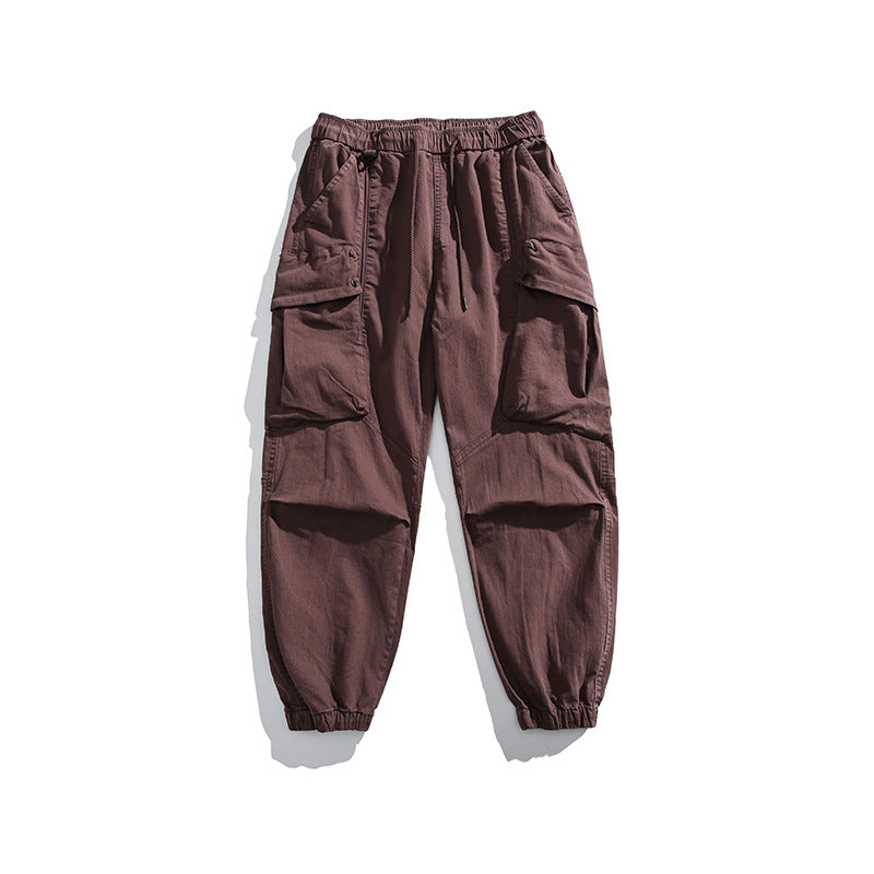 Men's utility cargo pants with elastic waistband, multiple pockets, and elastic cuffs.