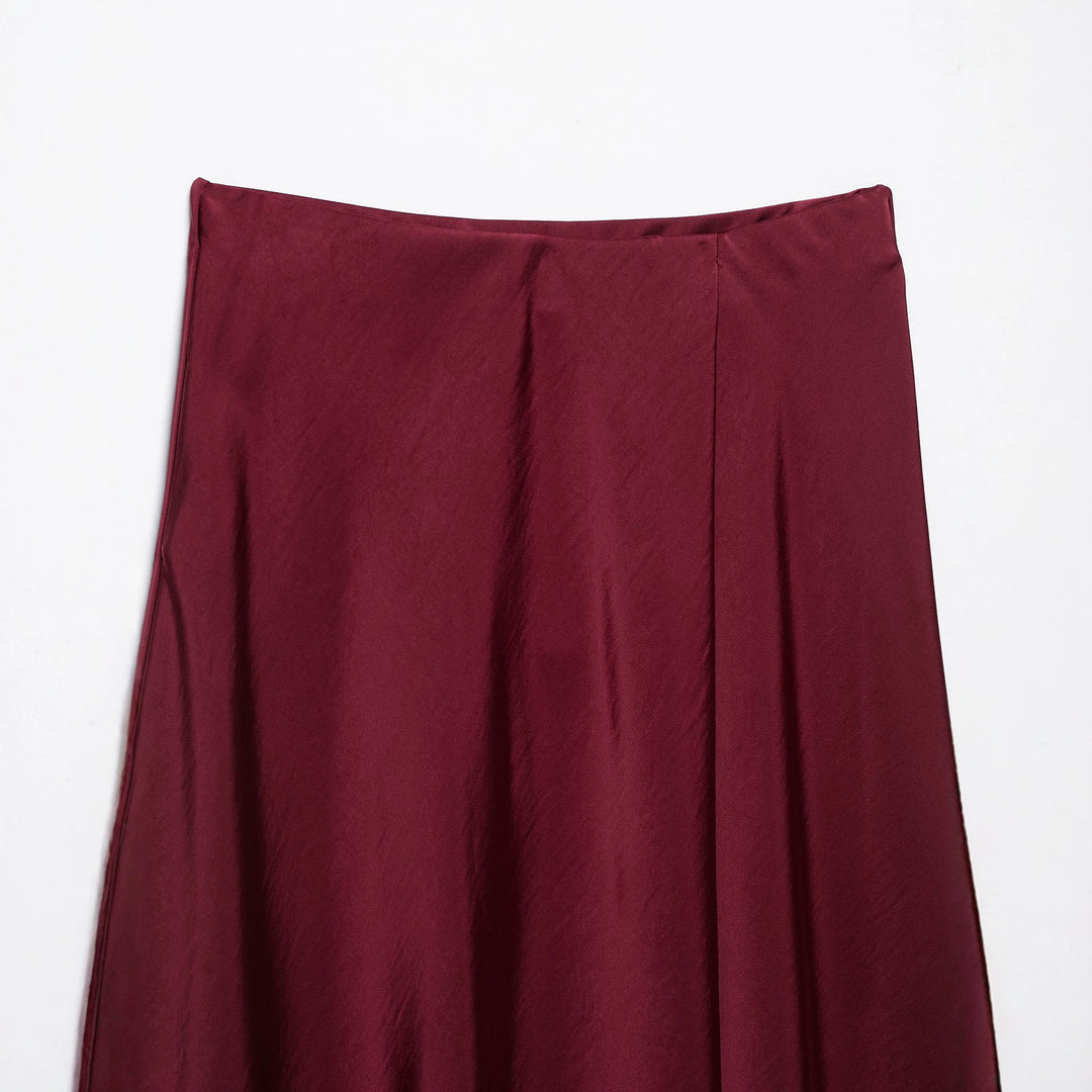 Women's flowy midi skirt in satin look with high waistband and asymmetrical hem Mune Fashion