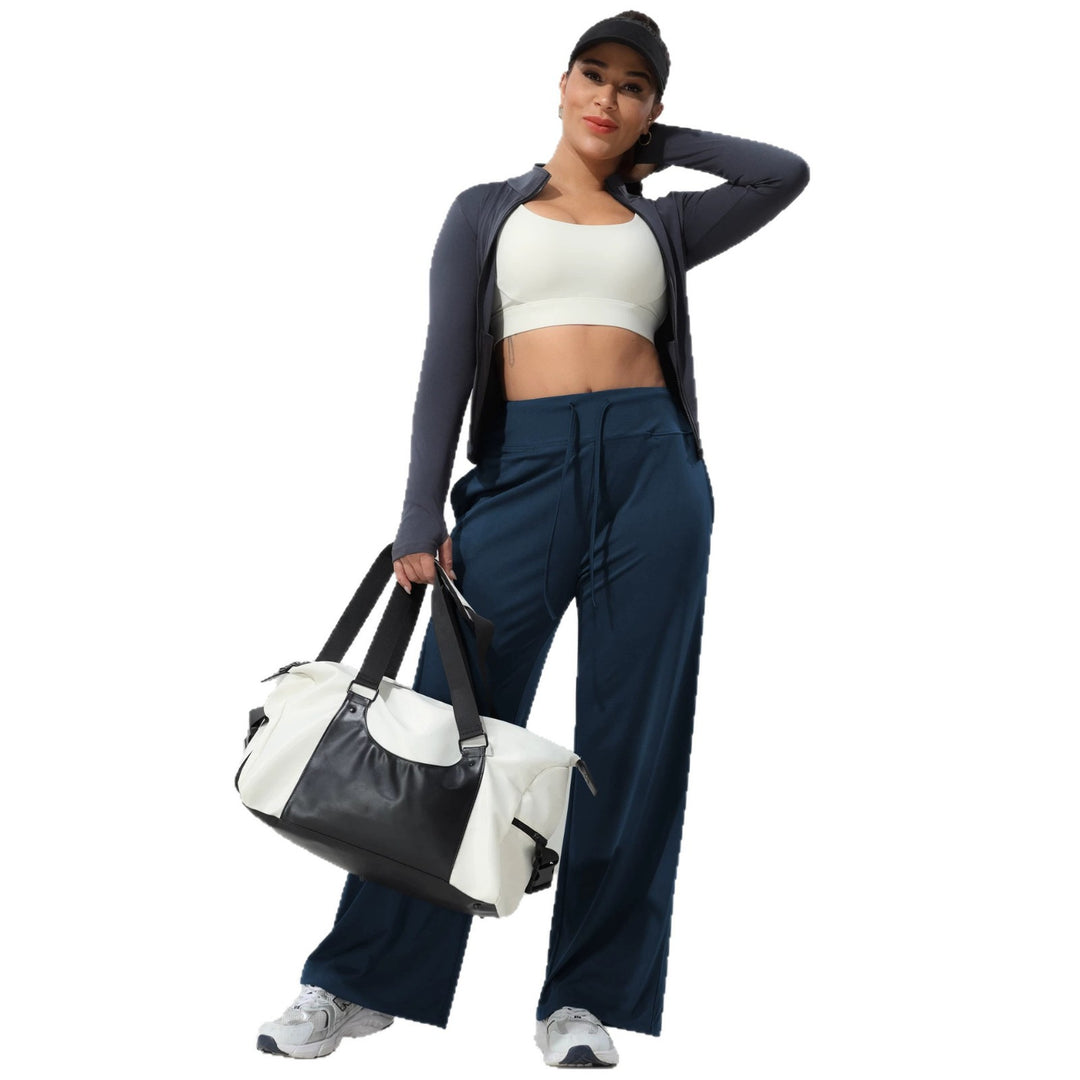 Women's jogging pants with high waistband, wide leg, drawstring, and side pockets Mune Fashion