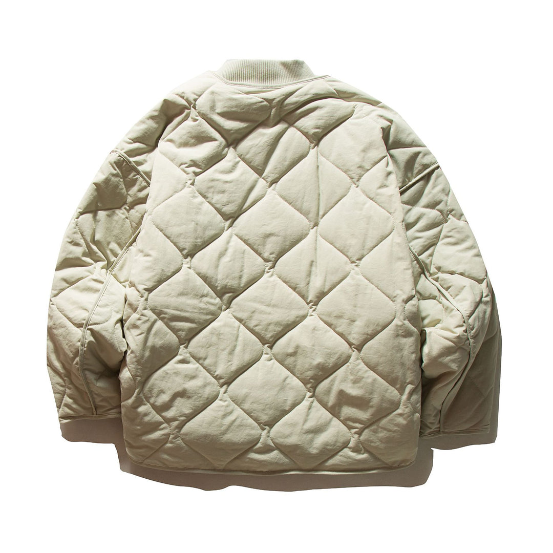 Unisex Short quilted bomber in boxy cut with ribbed collar and extra large flap pockets Mune Fashion