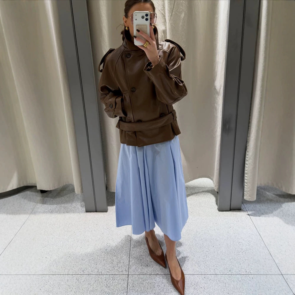 Women’s short cut oversized faux leather trench coat with waist belt and epaulettes Mune Fashion