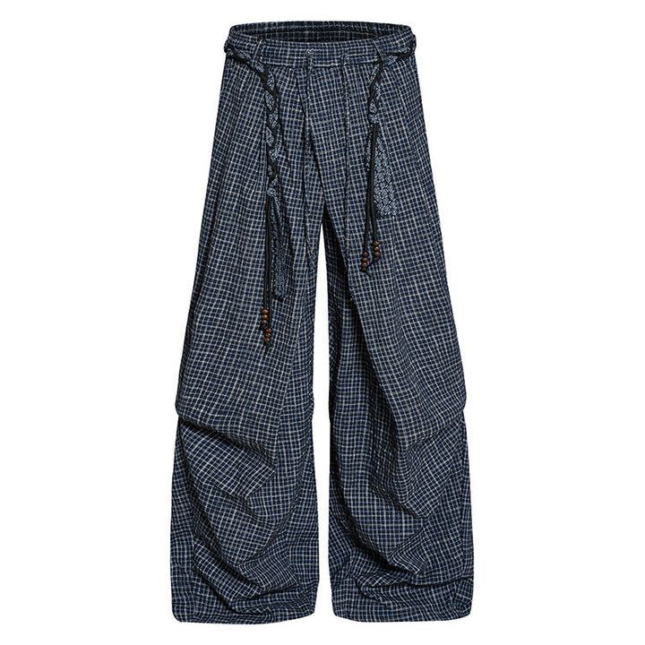 Women's wide palazzo pants with layered pleats, high waistband, and decorative cord belt Mune Fashion