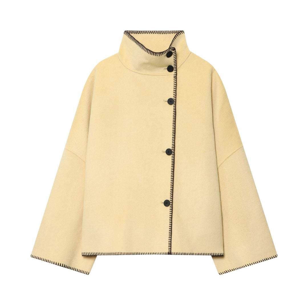 Women's cape coat with stand-up collar, asymmetric button placket and decorative seam Mune Fashion