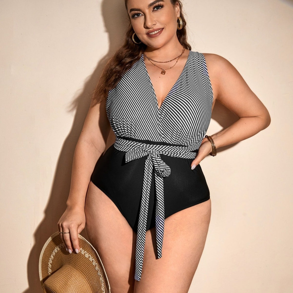 Ladies one-piece swimsuit with wrap detail and trendy stripe pattern Mune Fashion