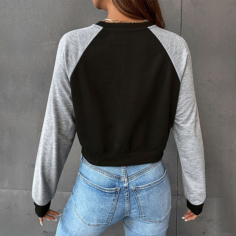Women's short cut raglan sweatshirt with thumb hole cuffs and elastic hem Mune Fashion