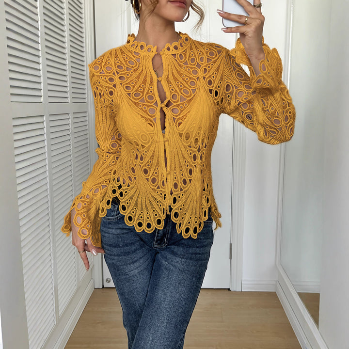 Women's filigree crochet lace blouse with stand-up collar, decorative button placket, and wavy hem Mune Fashion