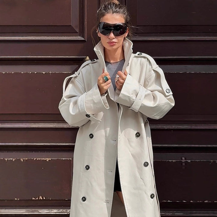 Women's waistless long trench coat in oversized cut with double button placket and shoulder epaulettes Mune Fashion