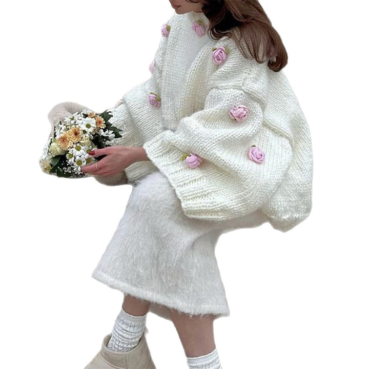 Women's oversized knit sweater with 3D floral appliqués and wide trumpet sleeves Mune Fashion