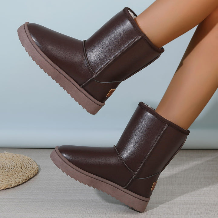 Women's winter boots with teddy lining, leather look and flat platform sole Mune Fashion