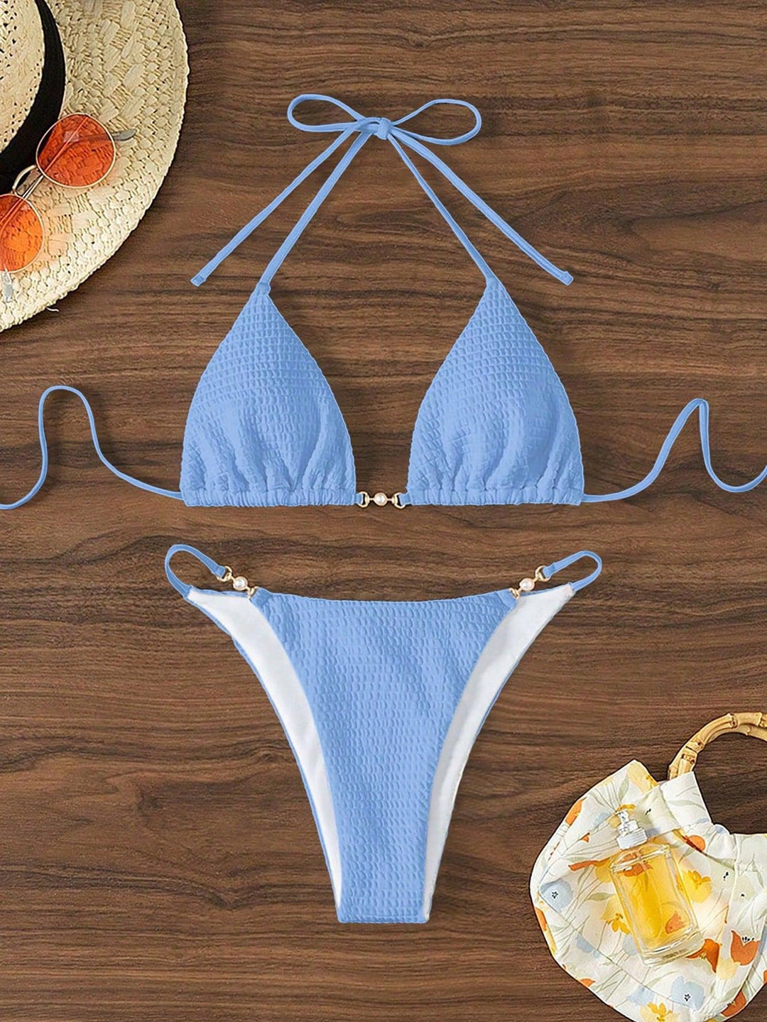 Women's Triangle Bikini with fashionable lacing details and elegant accents Mune Fashion