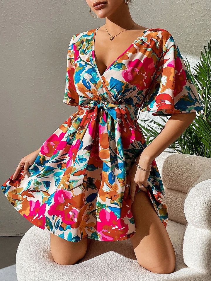 Women's wrap mini dress with deep V-neck, waist lacing, and wide trumpet sleeves Mune Fashion