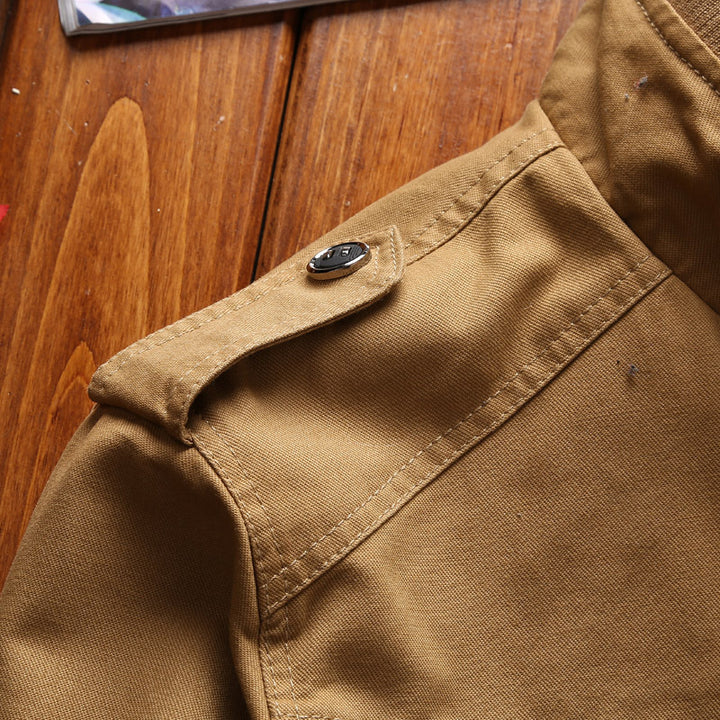 Men's lightweight canvas utility jacket with quilted lining, concealed two-way zipper, and elastic cuffs.