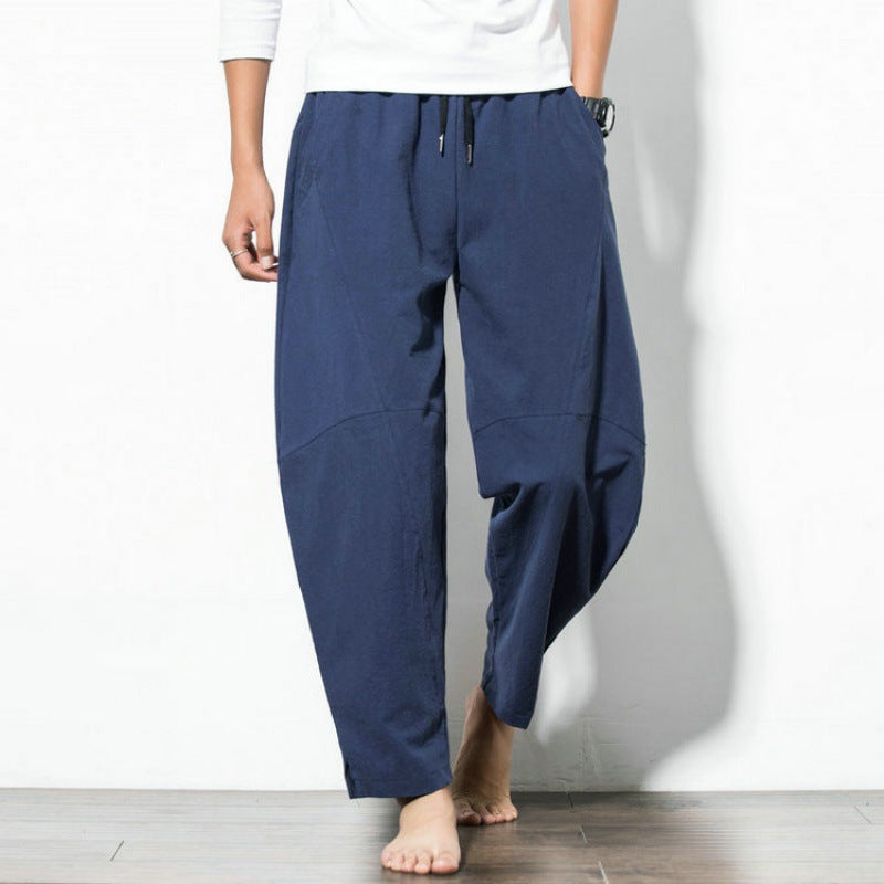 Men's loose harem pants made of cotton blend with elastic waistband, drawstring and side pockets Mune Fashion