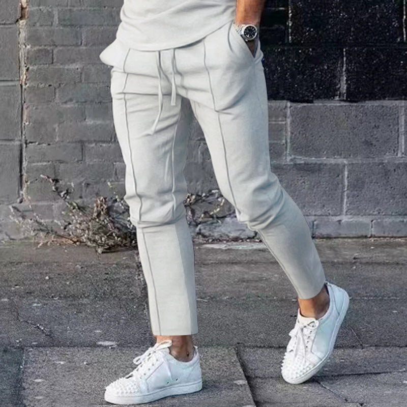 Men's Slim Tapered Jogging Pants with decorative stitching, elastic drawstring, and narrow ankle cuffs Mune Fashion