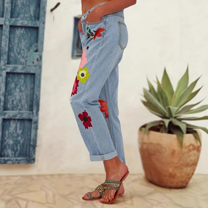 Ladies straight-cut jeans with colorful floral appliqués and light destruction details Mune Fashion