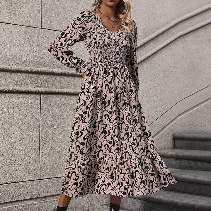 Women’s midi dress with elastic smock top, abstract all-over print and flared ruffle hem Mune Fashion