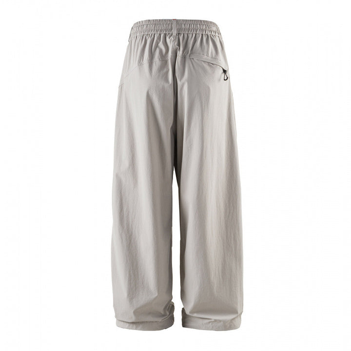 Unisex Loose-fitting technical cargo pants with elastic waistband, drawstring, and zip pockets Mune Fashion