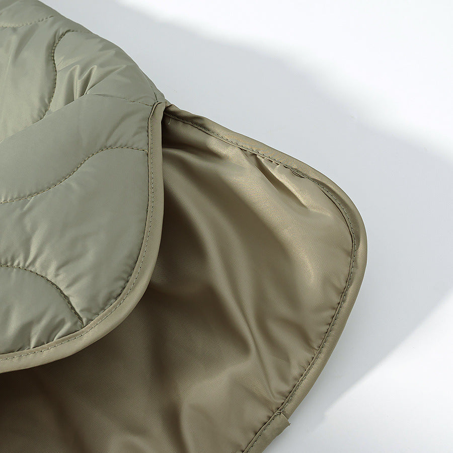 Women's lightweight quilted jacket with round neckline, quilted waves, and press buttons Mune Fashion