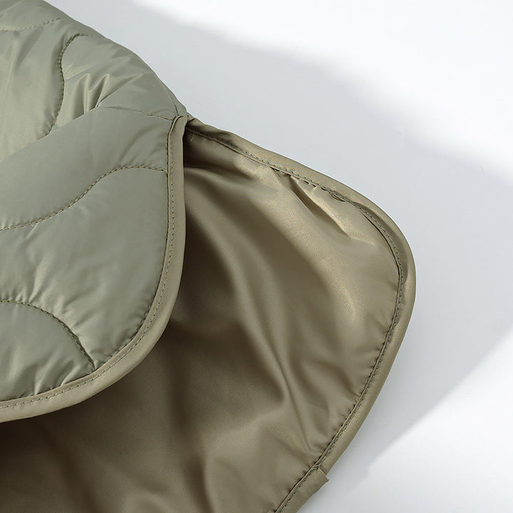Women's lightweight quilted jacket with round neckline, quilted waves, and press buttons Mune Fashion