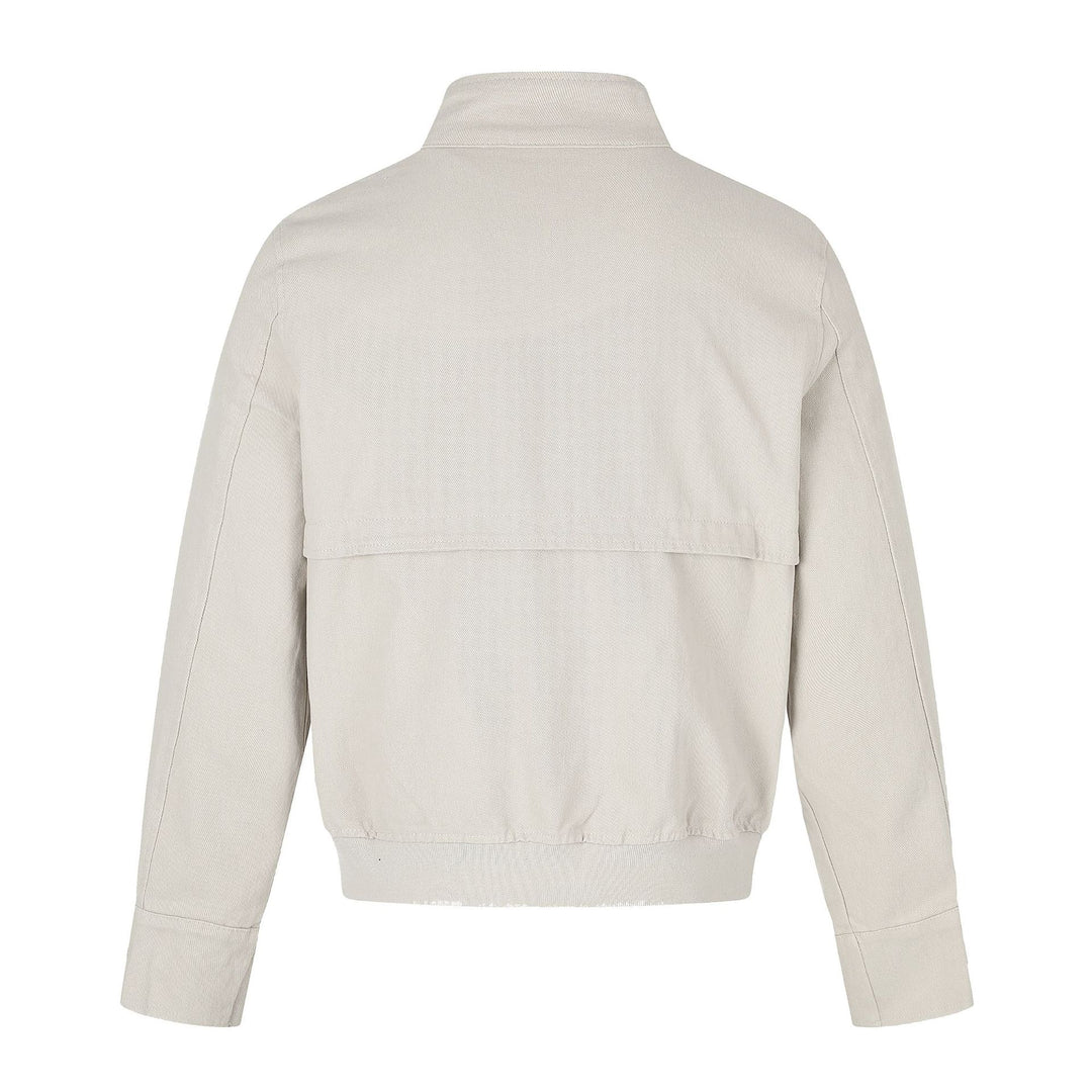 Women's short jacket in boxy cut with stand-up collar, buckle straps, and flap pockets.