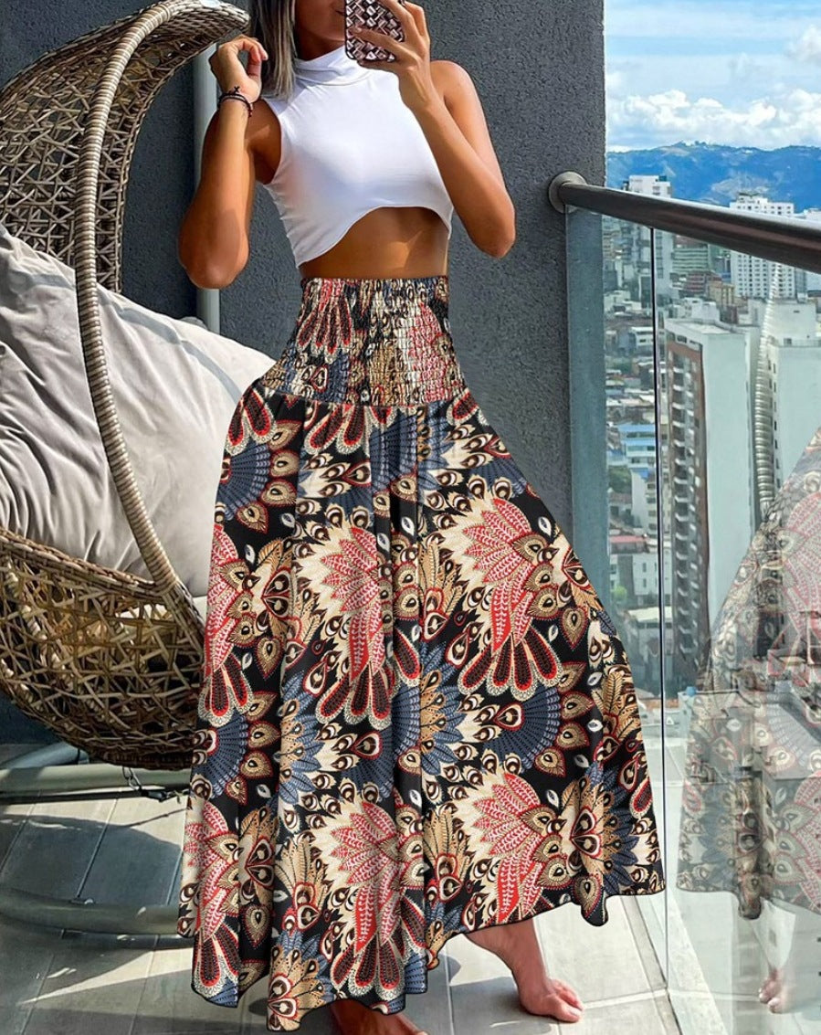 Women's maxi skirt with high smocked waistband, wide fall, and paisley print Mune Fashion