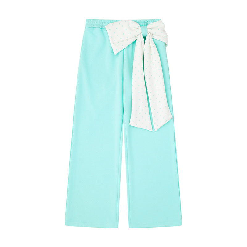 Women's culotte joggers with wide legs and decorative polka dot bow detail