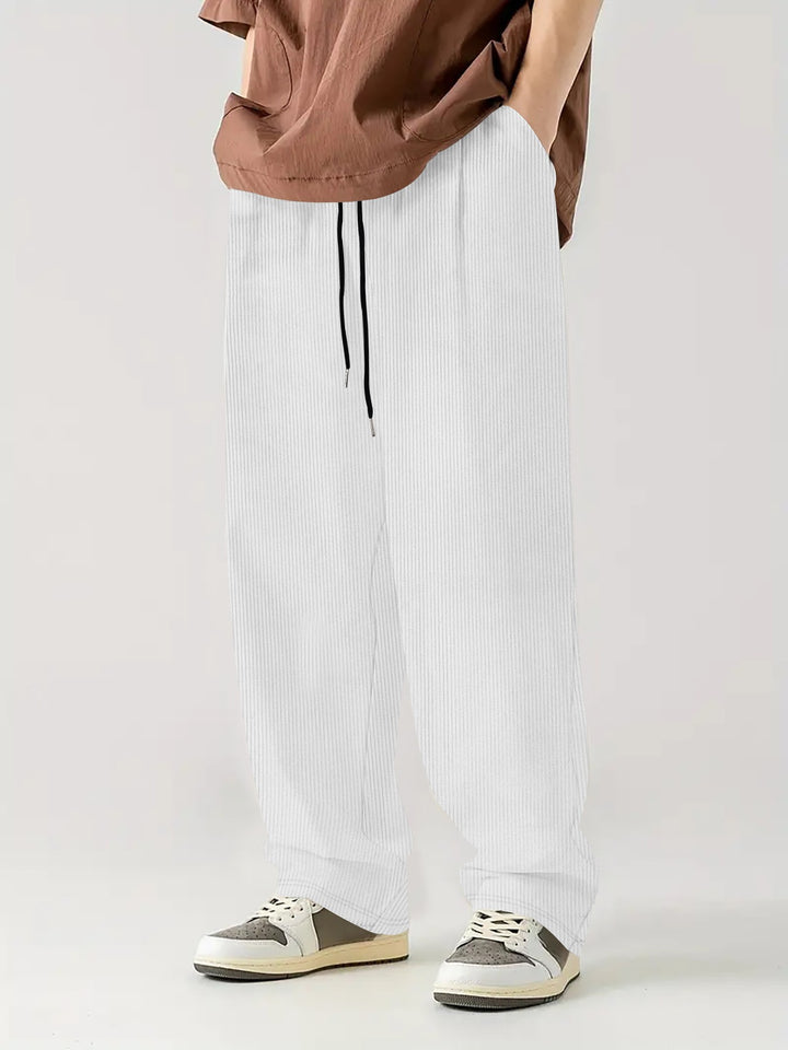 Men's loose Relax leisure pants made of ribbed jersey with drawstring, side pockets, and wide leg Mune Fashion