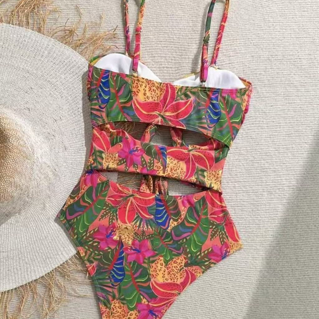 Women's one-piece swimsuit with decorative knot detail and playful floral design Mune Fashion