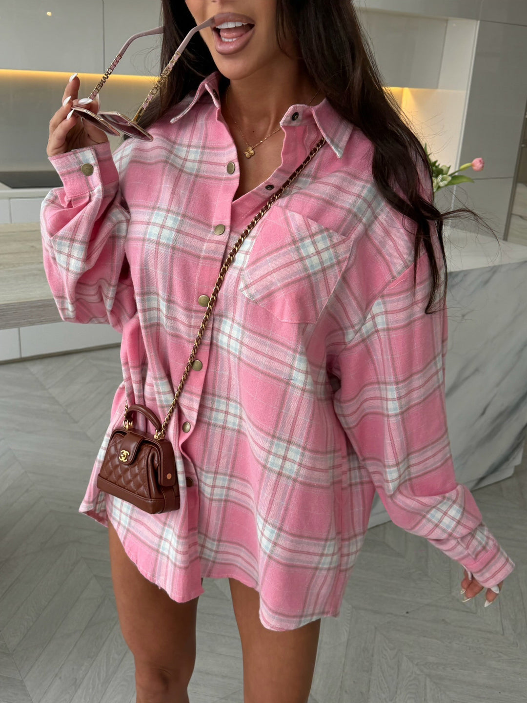 Women's oversized check shirt dress with button placket, chest pockets, and extended back hem Mune Fashion