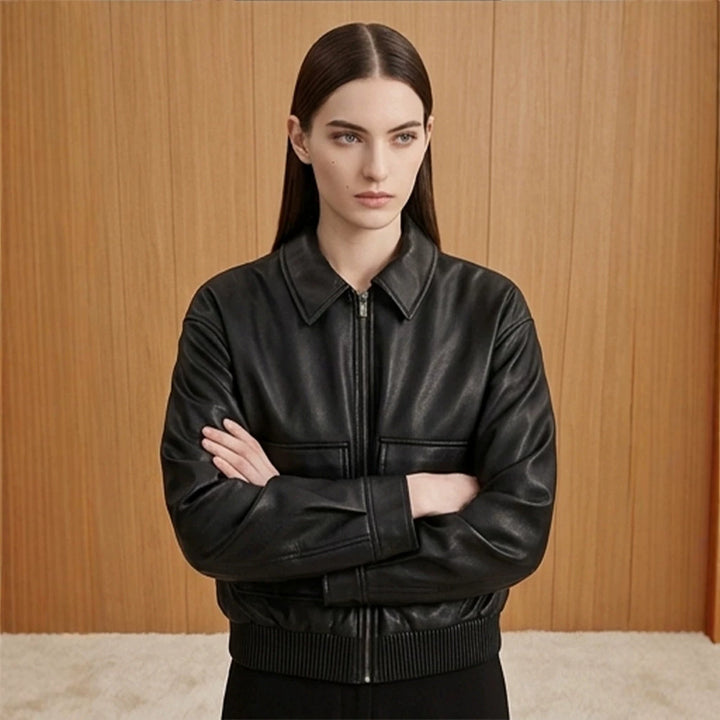 Women's short jacket made of faux leather in bomber style with ribbed hem and patch pockets Mune Fashion