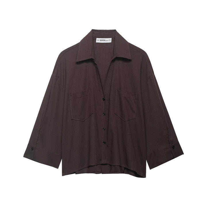 Women's oversized shirt blouse with fine striped pattern, chest pockets, and high-low hem Mune Fashion
