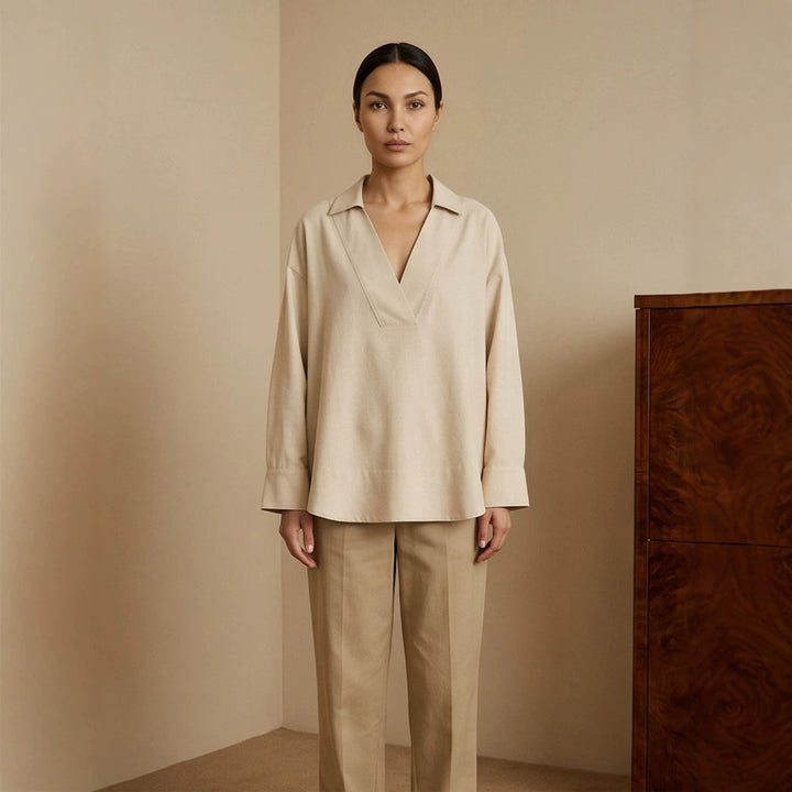 Women's loose-fitting tunic blouse with V-neck, shirt collar, and extended back hem Mune Fashion