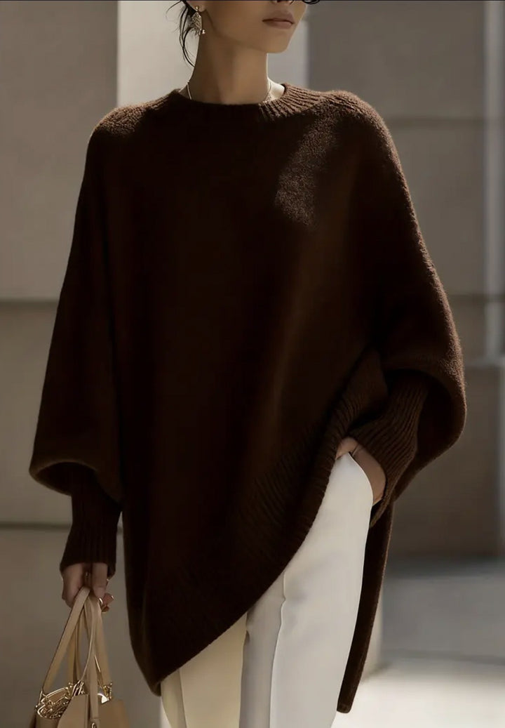 Women's oversized knit poncho with asymmetrical hem and ribbed sleeves Mune Fashion