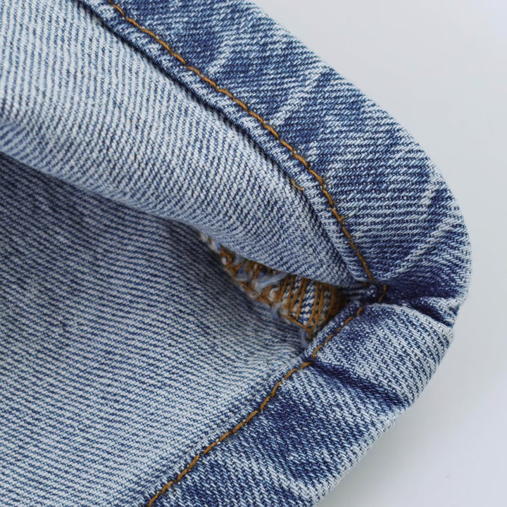 Women's sleeveless denim dress with body-hugging seam, A-line, and continuous button placket Mune Fashion