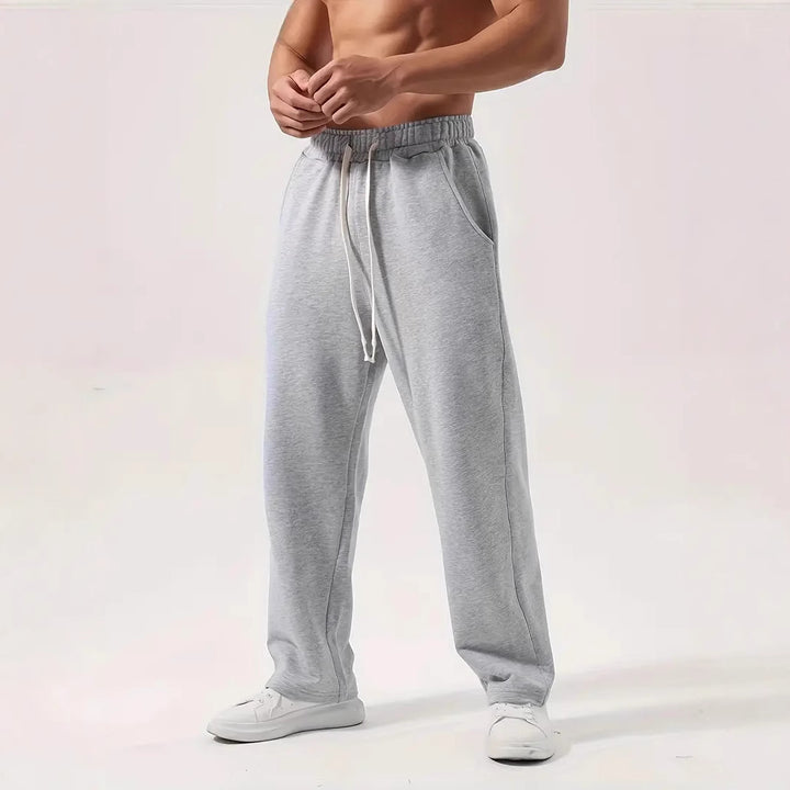Men's casually fitting sweatpants made of cotton blend with elastic waistband and side pockets Mune Fashion