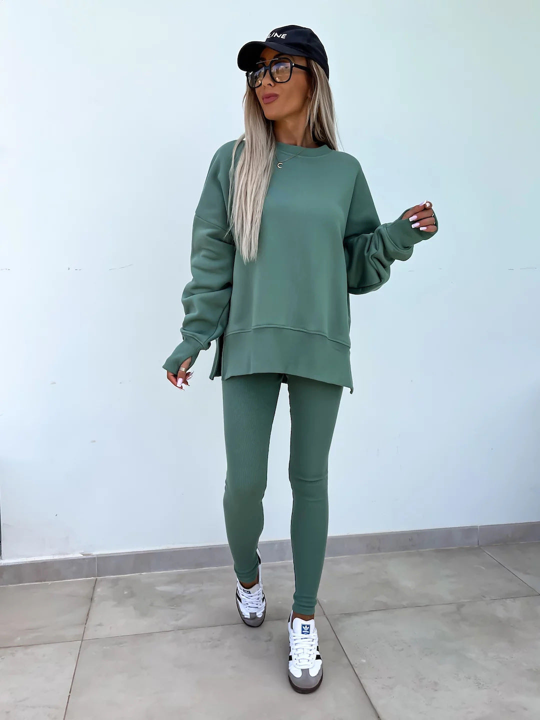 Women comfortable oversized lounge set with long sweatshirt, ribbed high-waist leggings and extended cuffs Mune Fashion