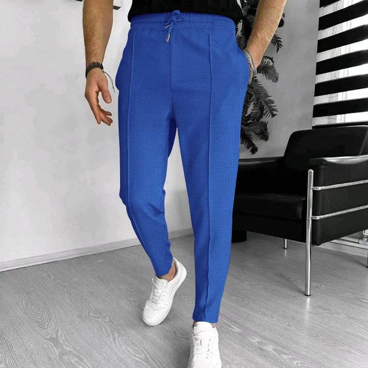 Men's tapered jogging chinos made of structured woven quality with elastic drawstring waistband and decorative crease Mune Fashion