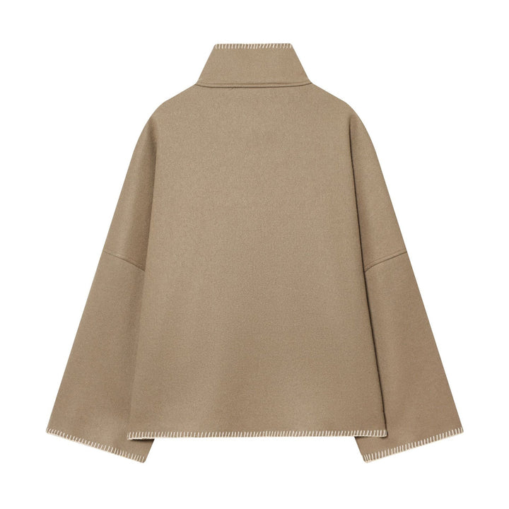 Women's cozy wool cape with high stand-up collar, asymmetrical button placket and decorative seam Mune Fashion