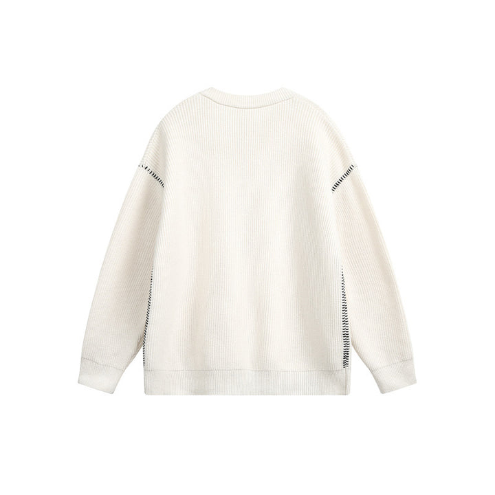 Unisex chunky knit henley pullover with button placket and drop shoulder drape
