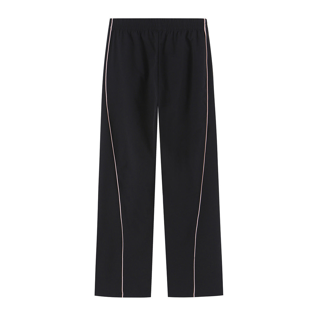 Women wide training pants with contrasting piping and elastic waistband Mune Fashion