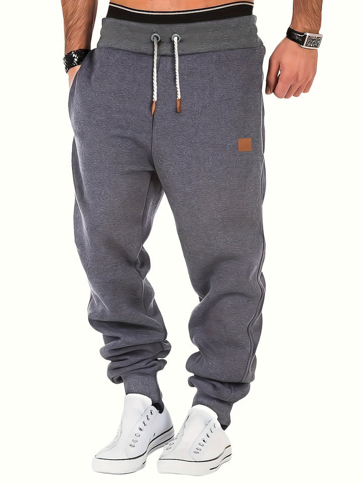 Men's mélange Relax Jogger with wide comfort waistband, twisted drawstring, and ribbed ankle cuffs Mune Fashion