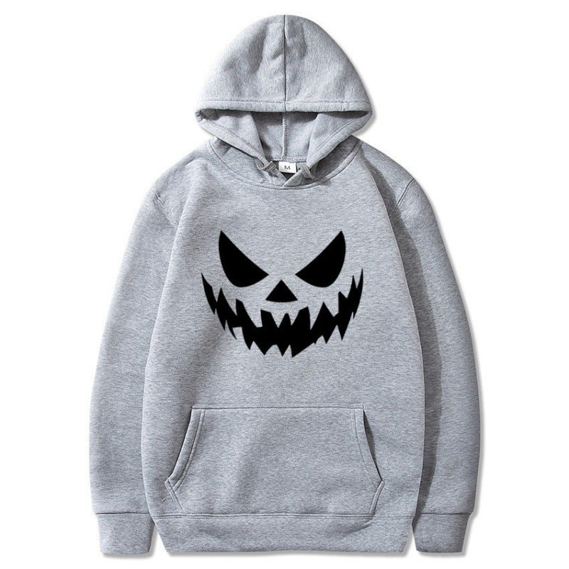 Unisex hooded sweatshirt with creepy pumpkin face print and oversized kangaroo pocket Mune Fashion