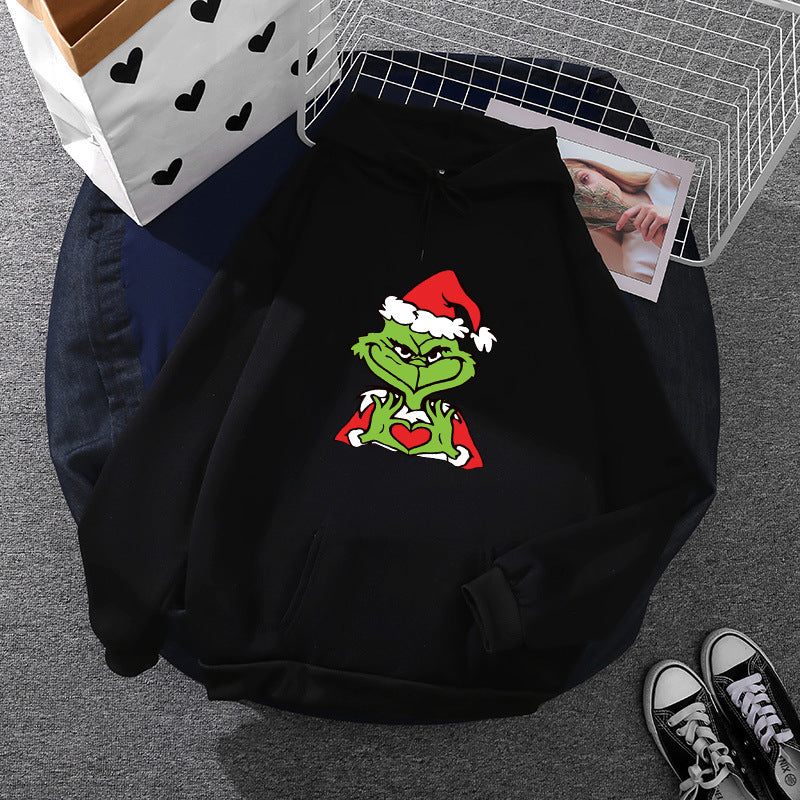 Unisex hoodie with soft fleece lining, kangaroo pocket and eye-catching Christmas comic print Mune Fashion