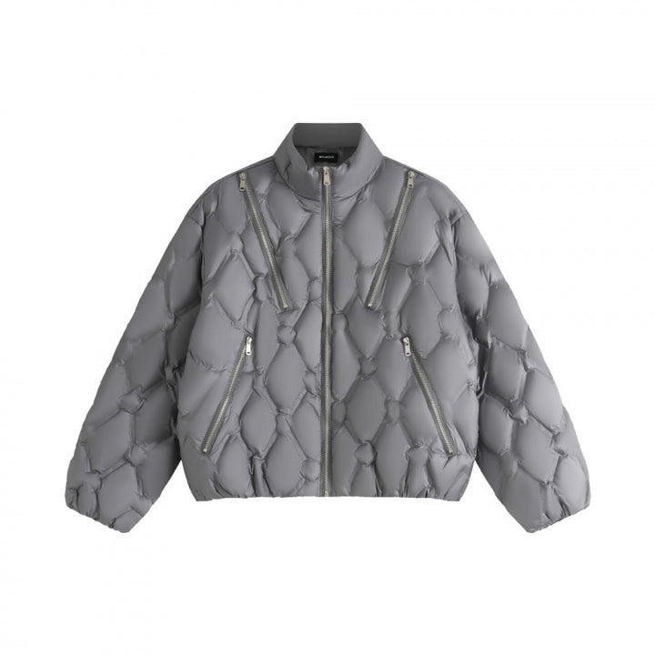 Unisex short cut quilted jacket in boxy cut with diamond quilting and diagonal zip pockets Mune Fashion