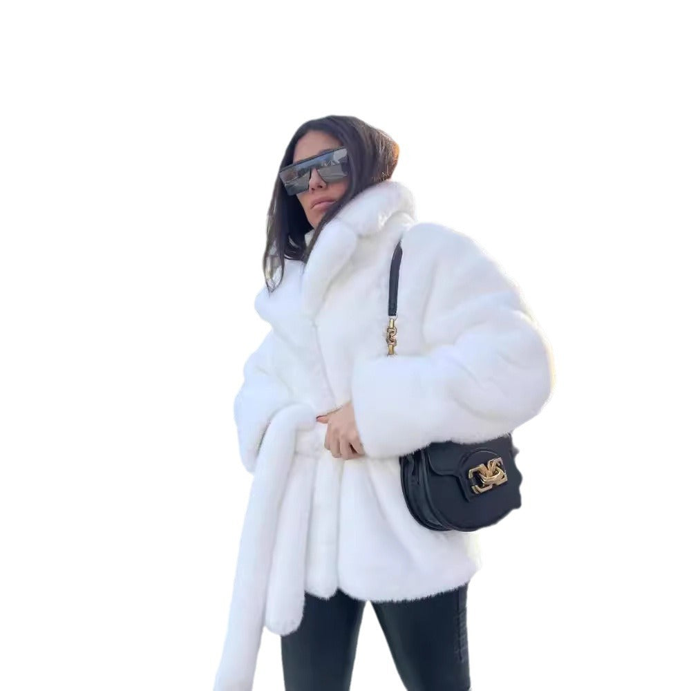 Ladies short coat made of luxurious faux fur with a waist belt and high shawl collar Mune Fashion