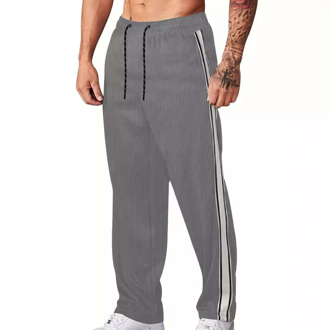 Men's knitted relaxed joggers with wide leg, side piping, and elastic drawstring waistband Mune Fashion