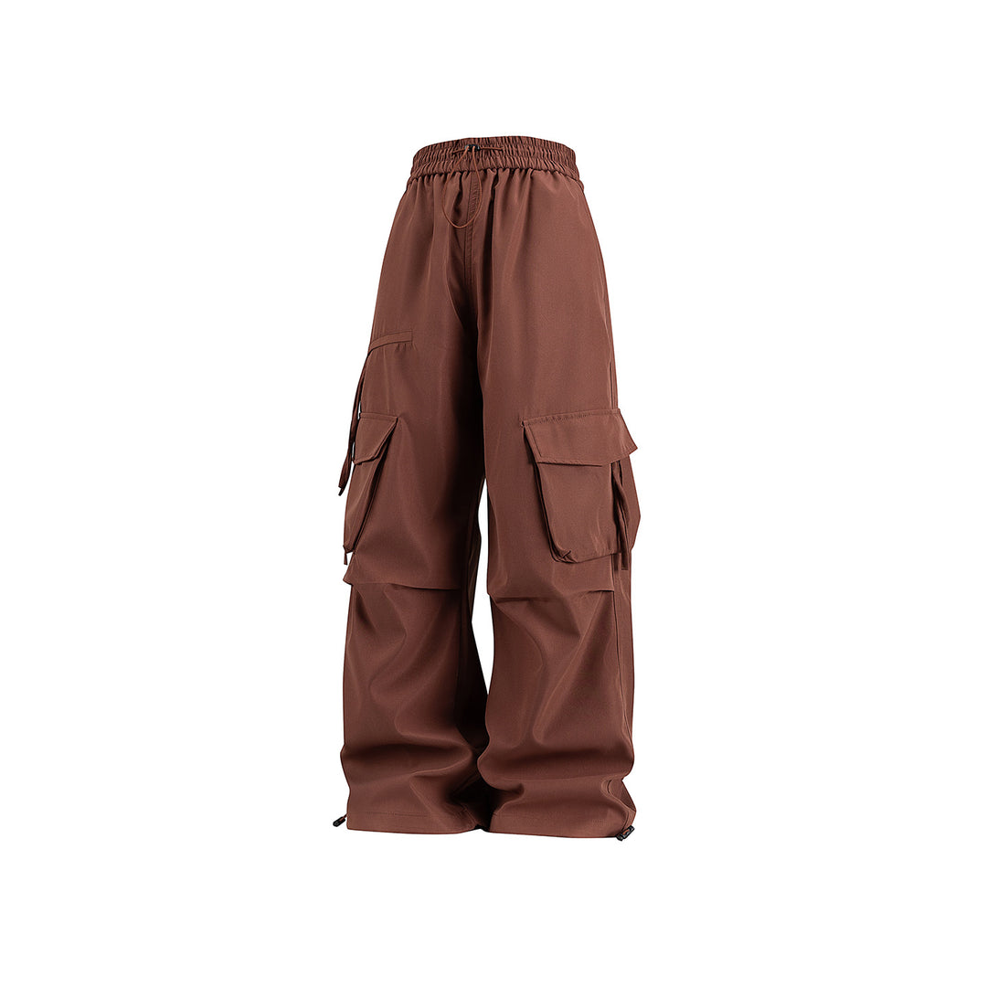 Damen Weite Cargo‑Hose im Baggy‑Cut mit elastischem Tunnelzugbund, Klapp‑Utility‑Taschen und verstellbarem Beinabschluss Mune Fashion
