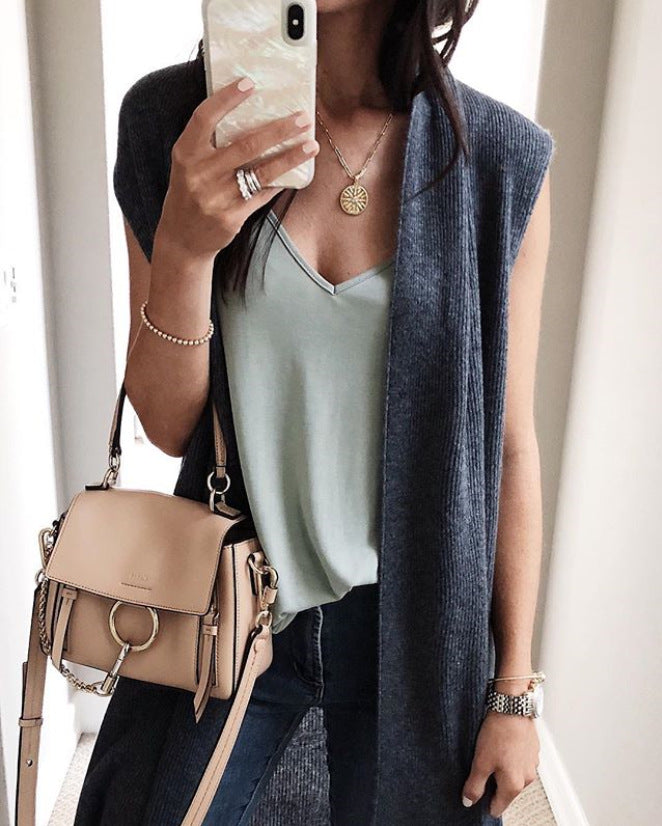 Women’s knit vest in a casual oversized design with open fronts and short sleeve length Mune Fashion