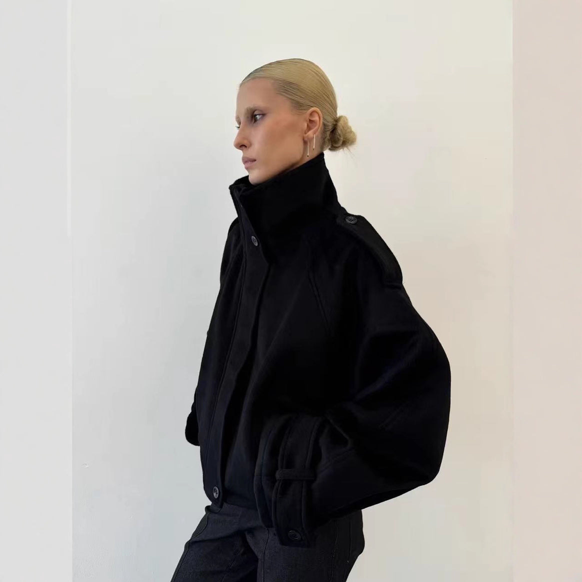 Ladies short cut oversized wool jacket with high stand-up collar, shoulder flaps and adjustable sleeve straps Mune Fashion
