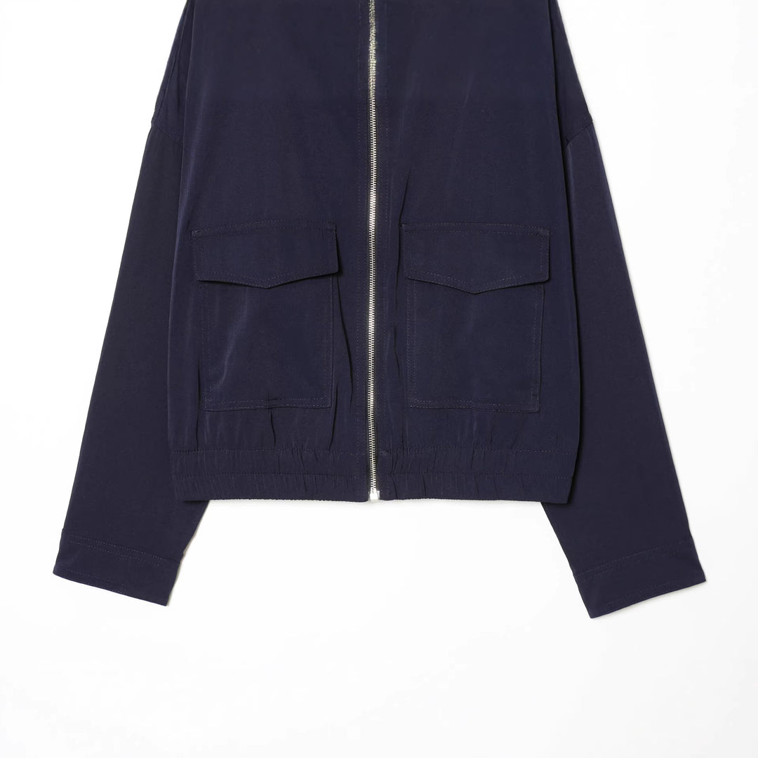 Women's short utility blouson jacket with standing collar, patch chest pockets, full zip, and elastic hem Mune Fashion